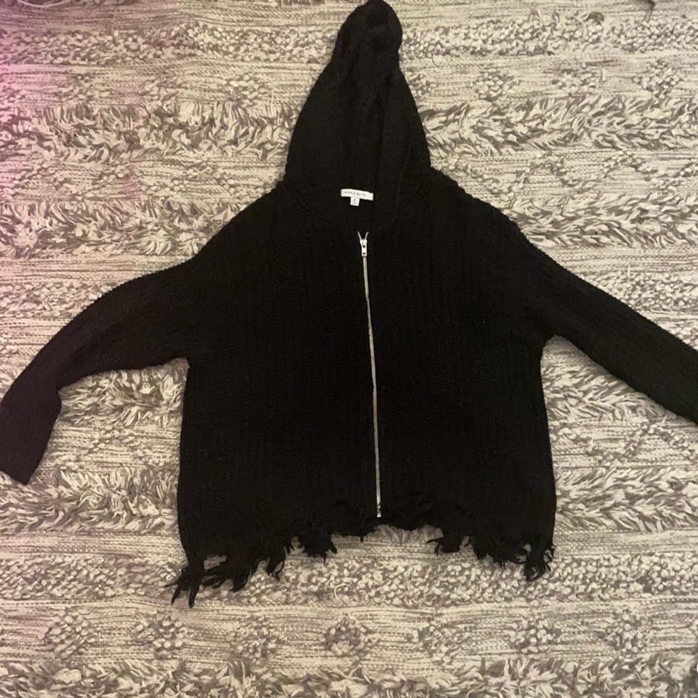 black sweater/hoodie frayed at the ends